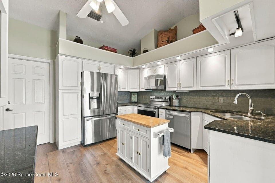 Home for sale at 409 Maple Bluff Circle, Melbourne, FL 32940 – 3 bed, 2 bath, photo 6