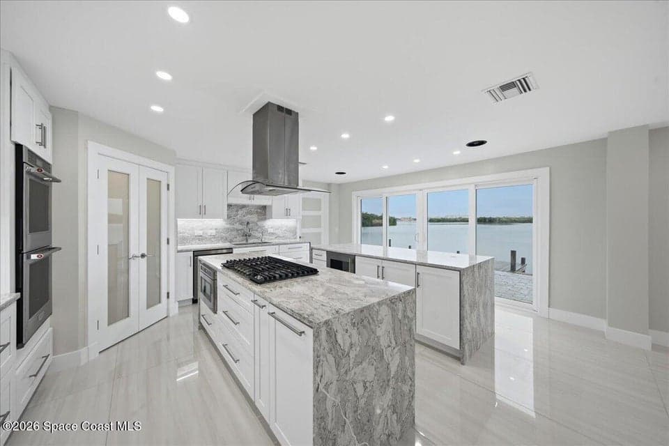Home for sale at 415 Island Drive, Merritt Island, FL 32952 – 4 bed, 4 bath, photo 3